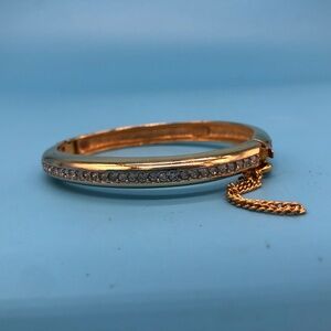 Vintage Trifari Gold Tone Rhinestone Hinged Bangle Bracelet Safety Chain